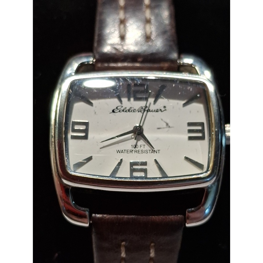 Eddie Bauer Ladies Watch. Silvertone, Brown Leather Strap. Model#V8V152.